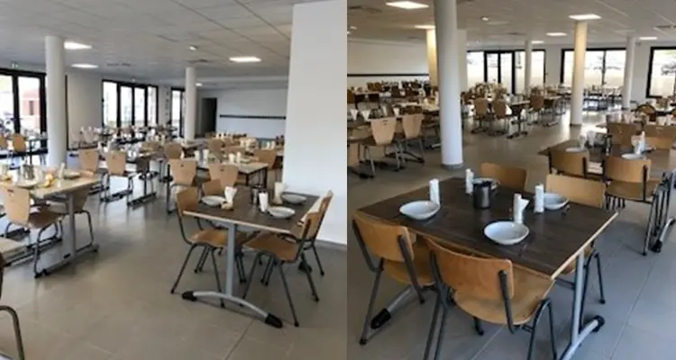 Réfectoire Manon des Sources : grande salle claire à piliers blancs, tables dressées et chaises en bois